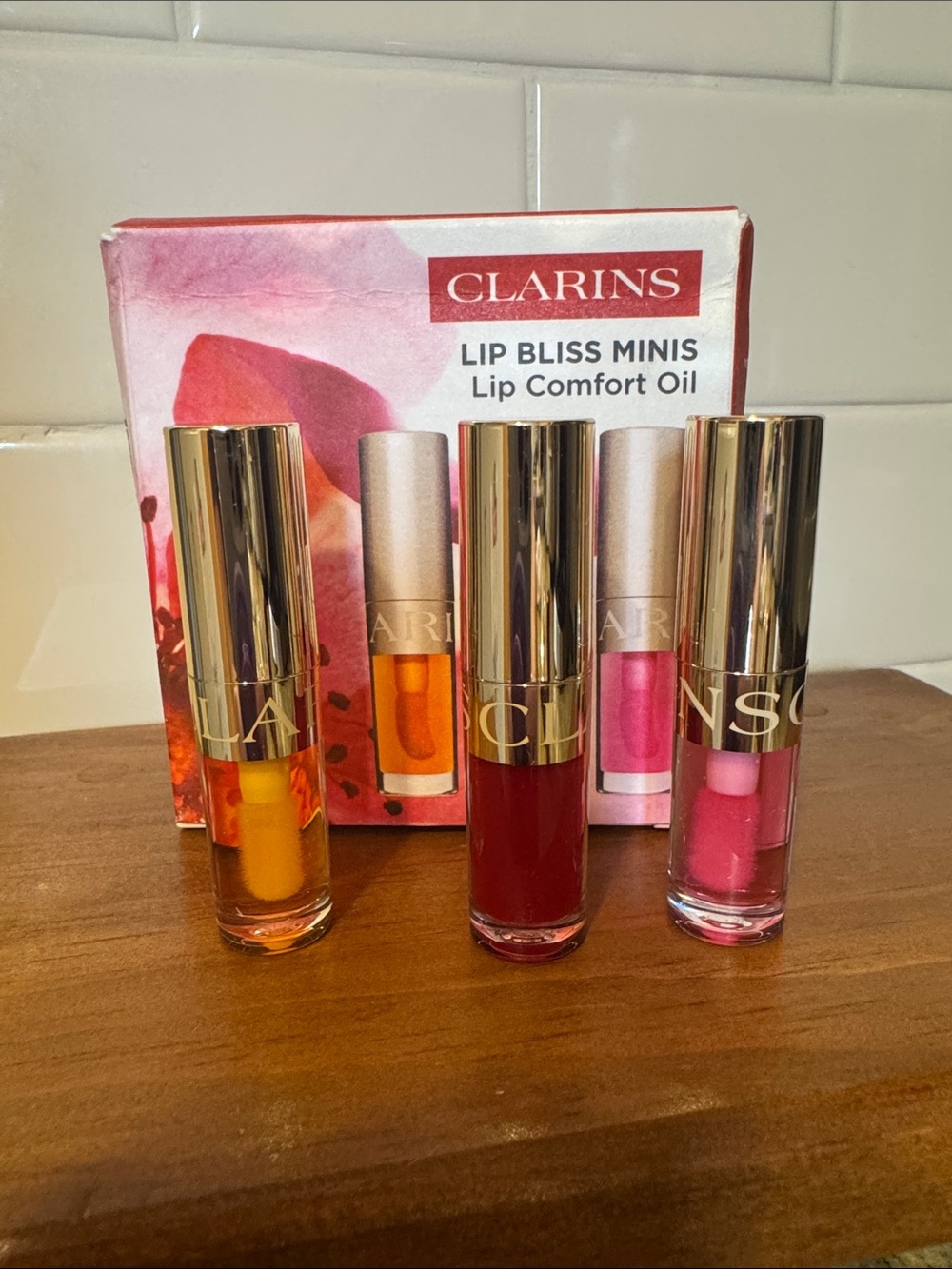 Clarins Lip Bliss Minis Lip Comfort Oil Trio - Red, Pink, Orange - Picture 5 of 10